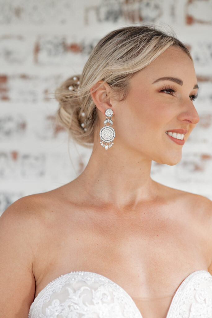 Model wearing Kyla Jewelry's 3-Tier Bridal Collection earrings