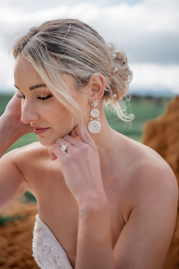 Model wearing Annabelle an earring part of Kyla Jewelry's Bridal range.