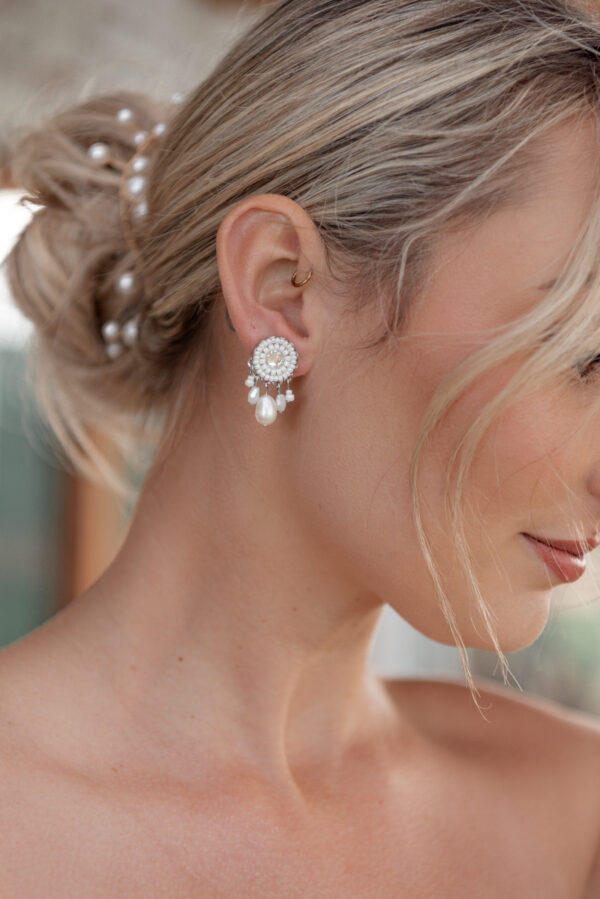 Model wearing Isla an earring part of Kyla Jewelry's Bridal range.