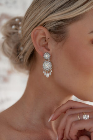 Model wearing Emma an earring part of Kyla Jewelry's Bridal range.