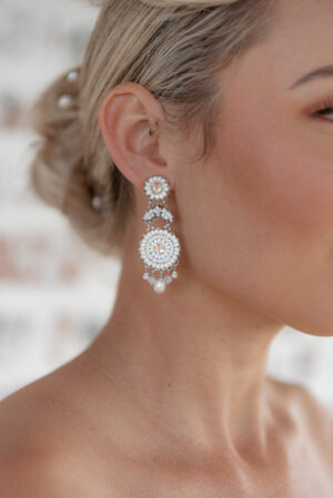 Model wearing Lana an earring part of Kyla Jewelry's Bridal range.