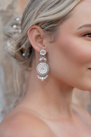 Model wearing Gina an earring part of Kyla Jewelry's Bridal range.