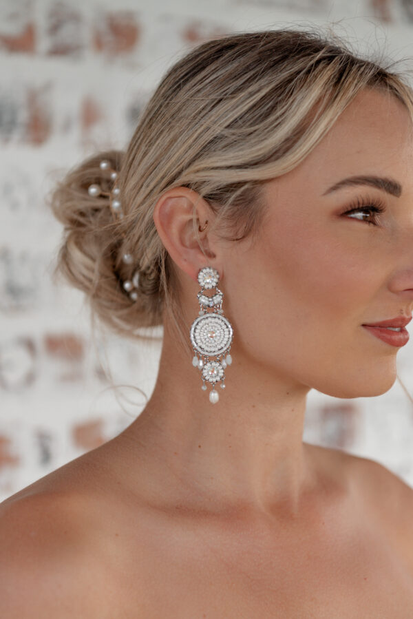 Model wearing Kyla an earring part of Kyla Jewelry's Bridal range.